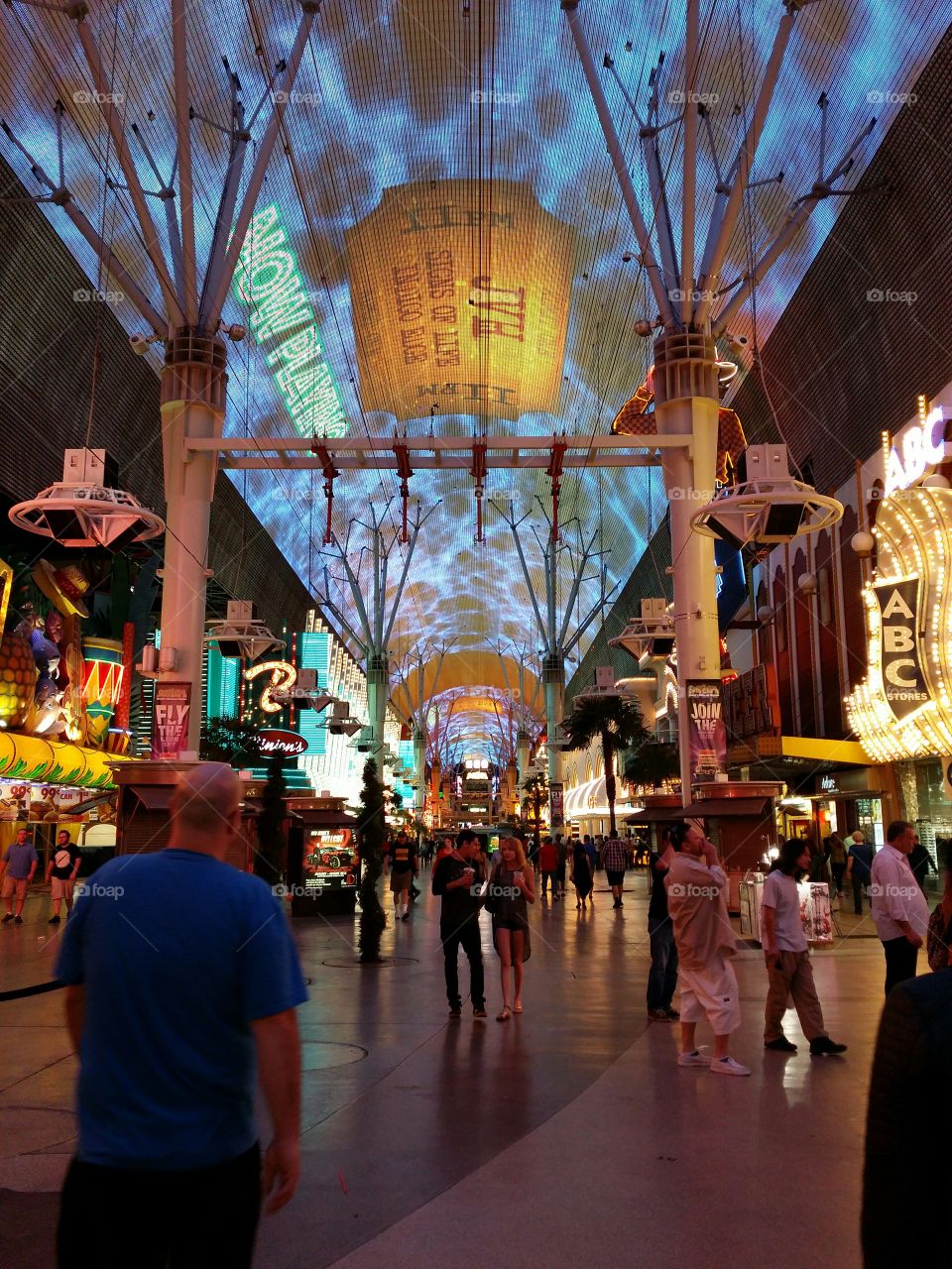 Downtown Vegas, Fremont Street. Awaiting the arrival of the zip-line riders while looking straight down the zip-line and world's largest video screen.