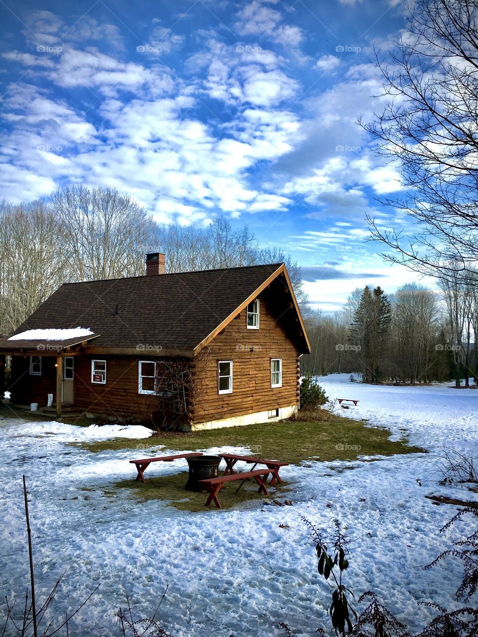 A cabin in Maine at the end of winter, as spring begins.