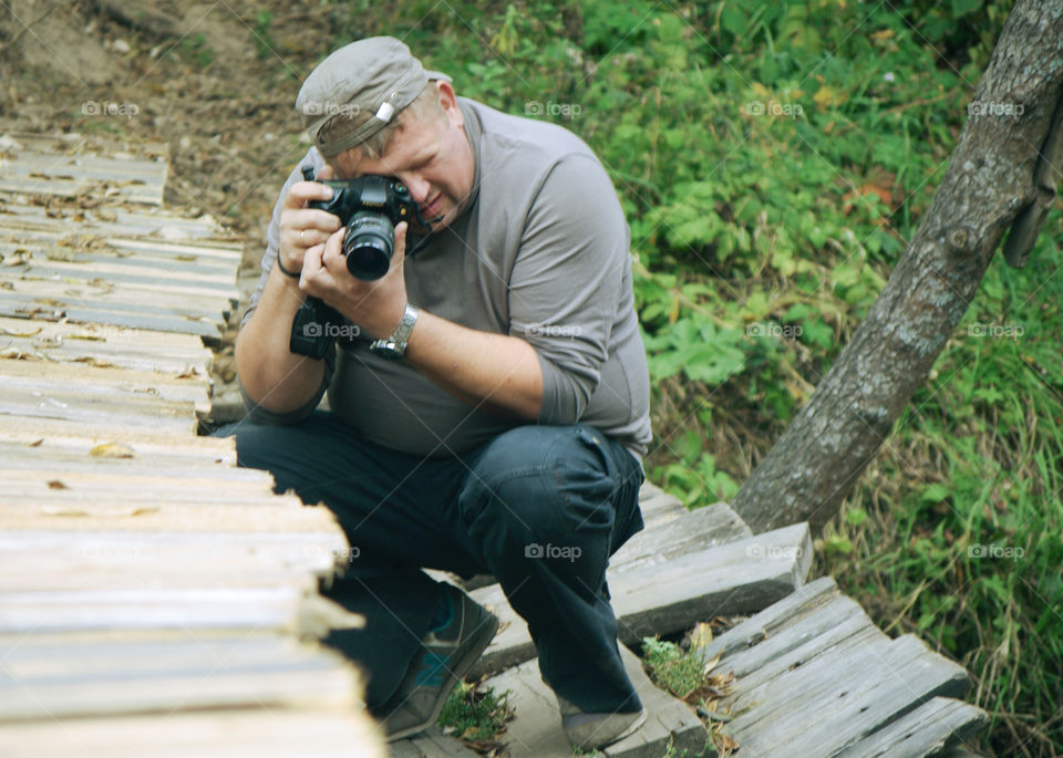 Male photographer taking pictures