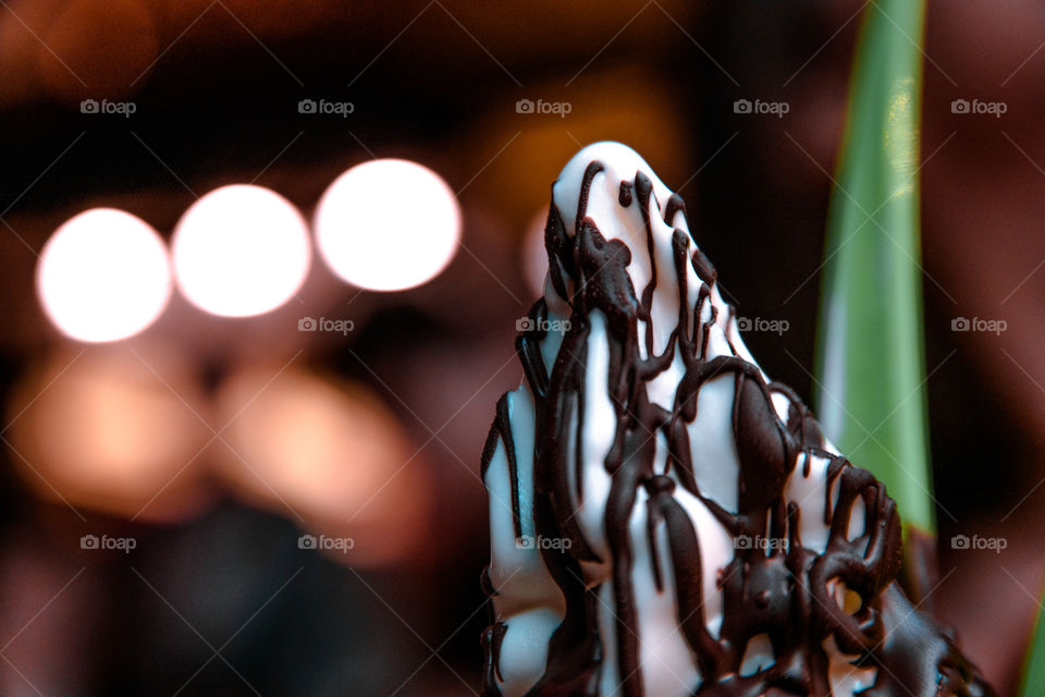 Close-up of ice cream with chocolate sauce