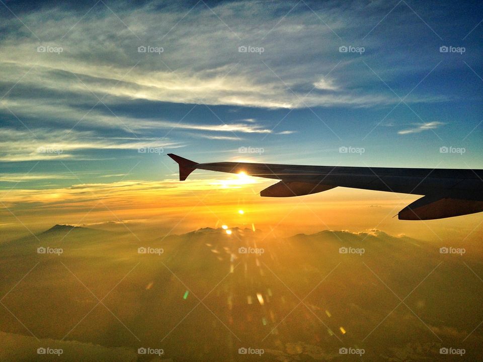 Enjoying sunset while on a plane