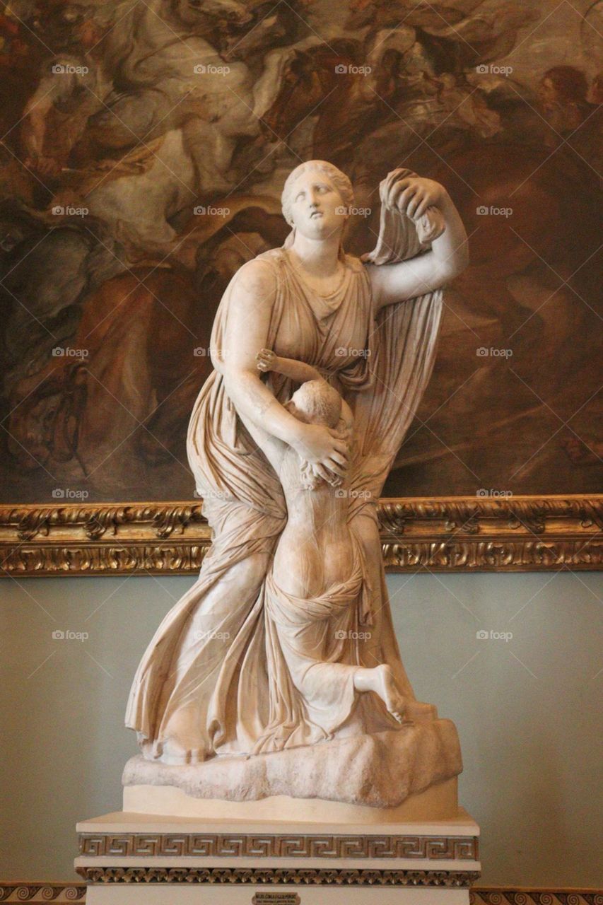 Niobe tries to defend his daughter from the gods, Apollo and Artemis, ready to kill all his sons, for insulting Latona, declaring himself a better mother than her and his pride was punished. 
