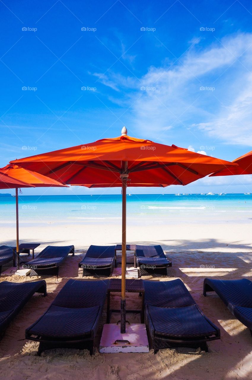 Lounge chairs by the beach