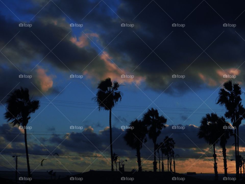 Blue skies under stormy clouds 