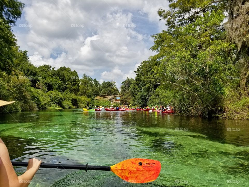 Kids having a school field day Kayaking down the river