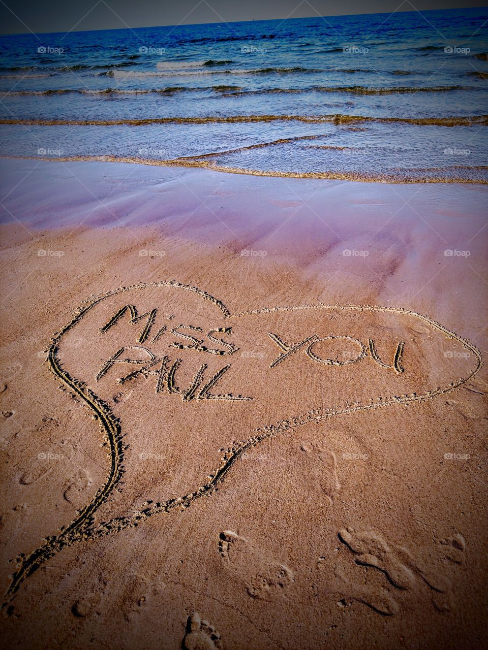 missing my child's and wrote in the sand. army strong!