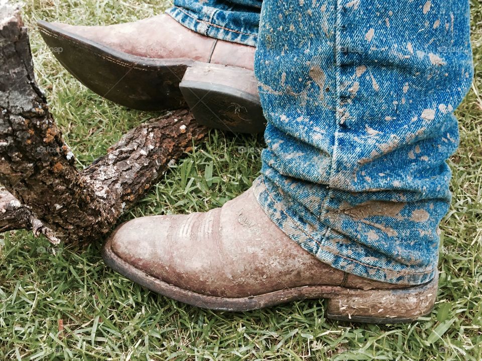 Muddy boots and jeans from doing farm chores. 