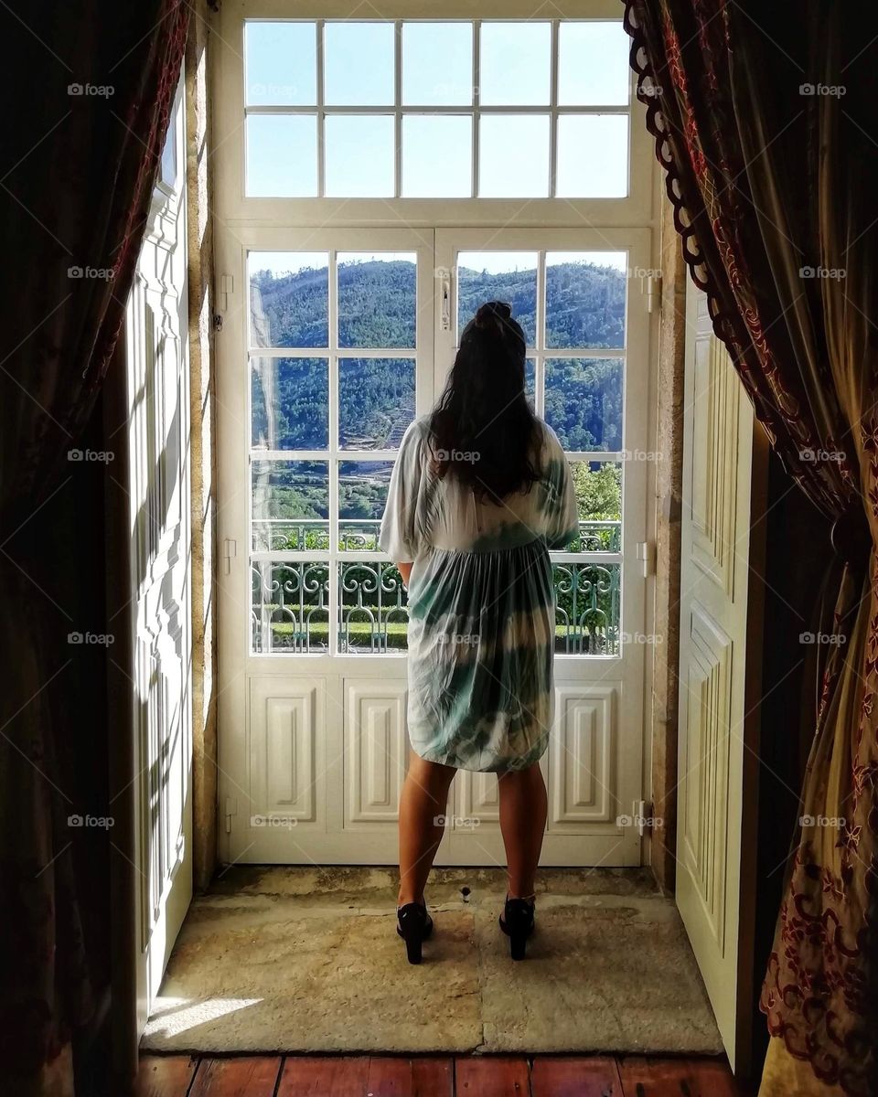 Woman standing in front of a window