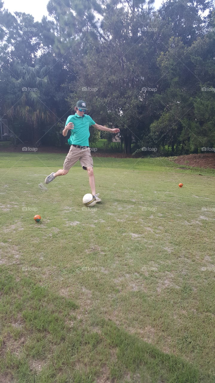 Boy Playing Footgolf