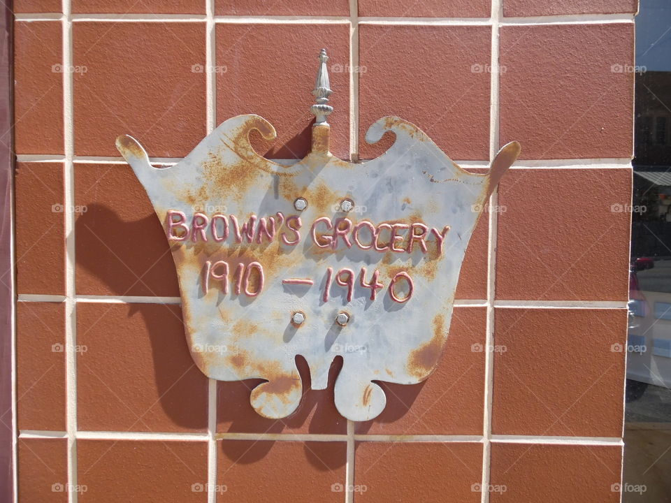 Browns grocery. This is a vintage sign description of a grocery store established in 1910