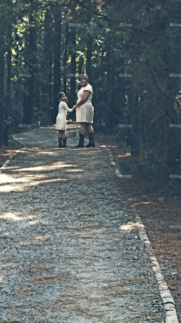 wedding pictures in the park . grandmother and granddaughter. forest pictures. trails in the park..