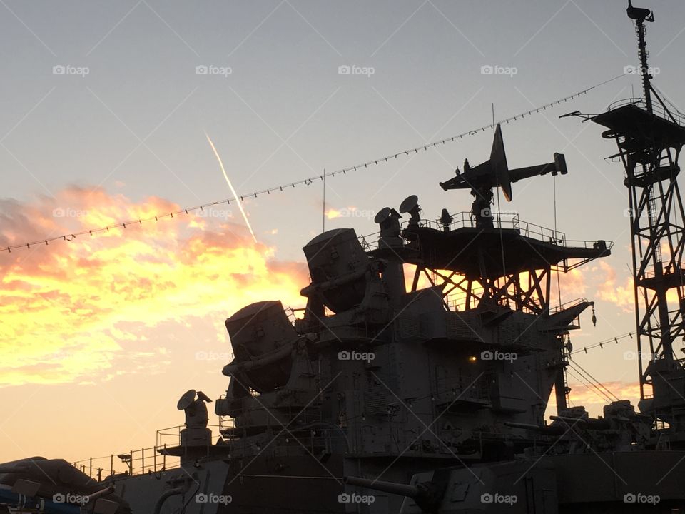 Military boat against the sunset sky