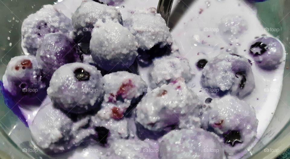 Frozen blueberries and milk