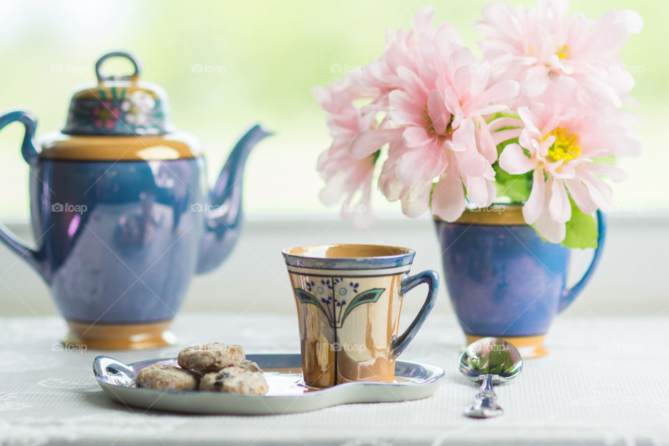Close-up of tea set with flowers