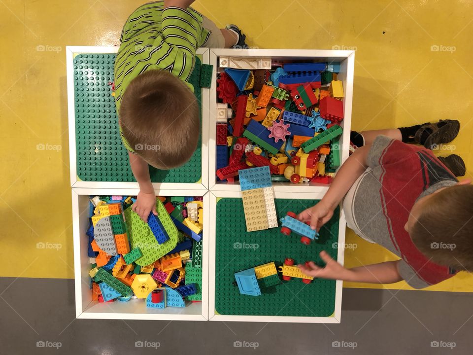 Boys playing with lego