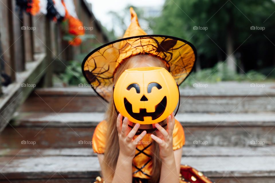 Kid celebrating Halloween outdoor 