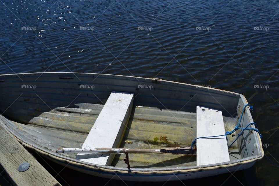 Old rowboat, dinghy. Old rowboat, dinghy tied to dock