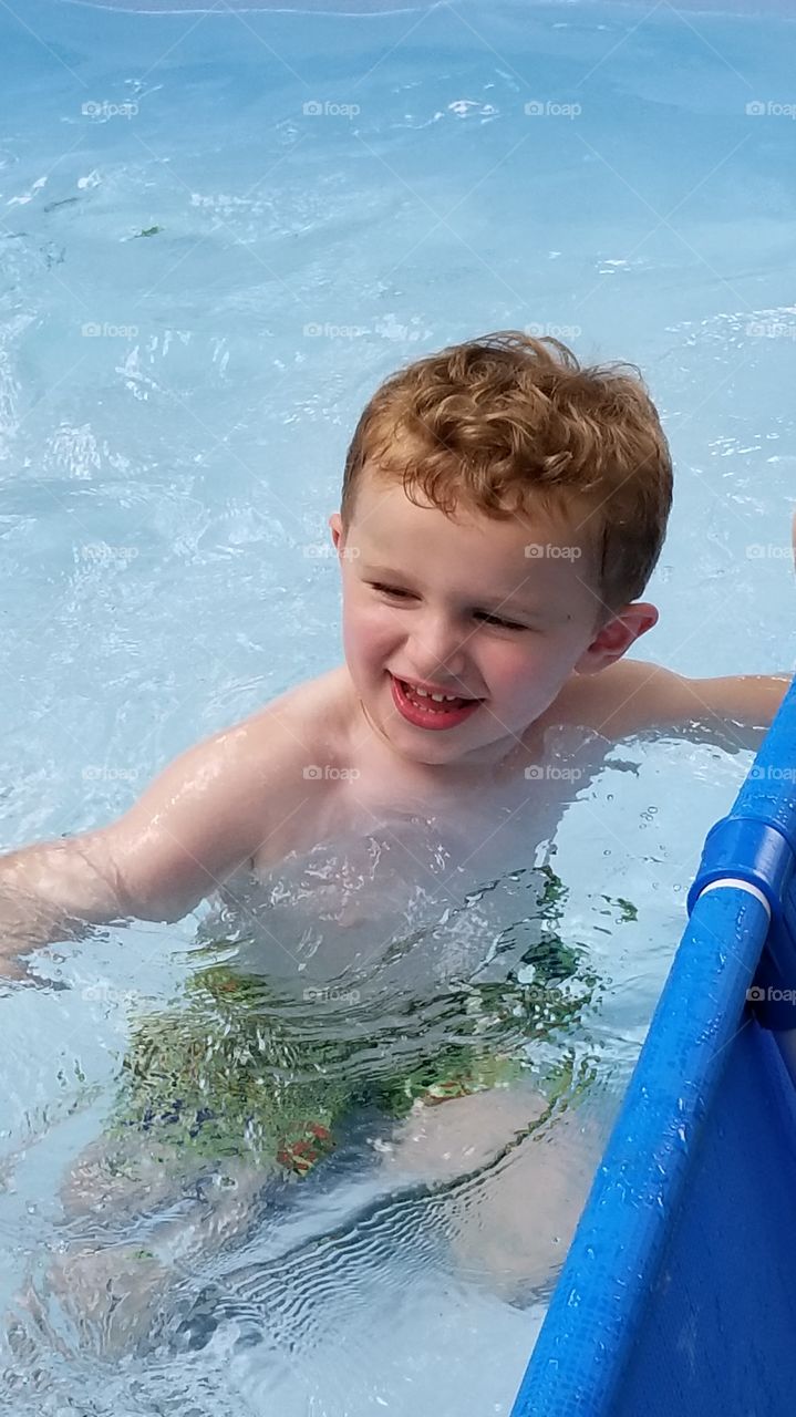 Baby boy swimming