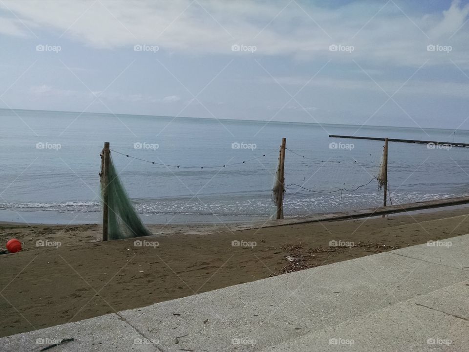 fishermen nets abandoned at seaside
