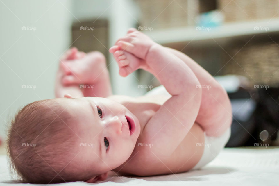 Baby rolling on his back