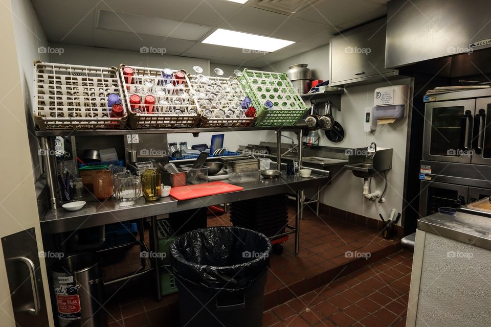 Kitchen storage cleaning equipment inside the restaurant 