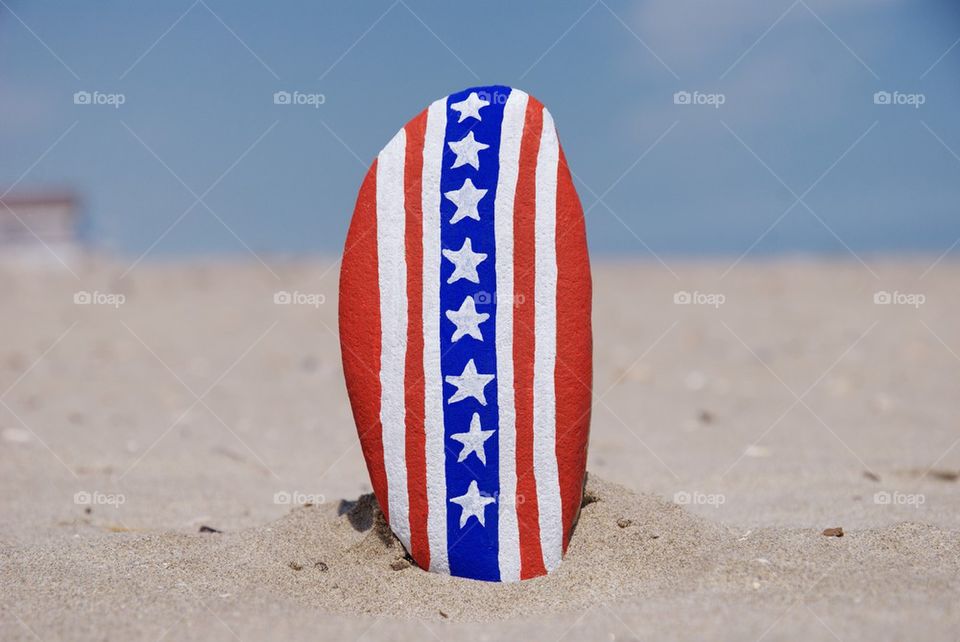 Vertical USA flag on a stone
