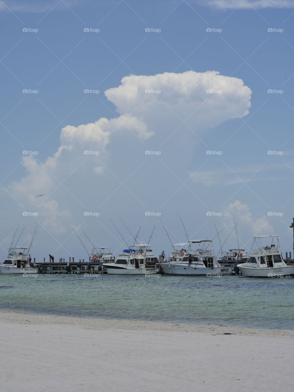 clouds on Caribbean pier