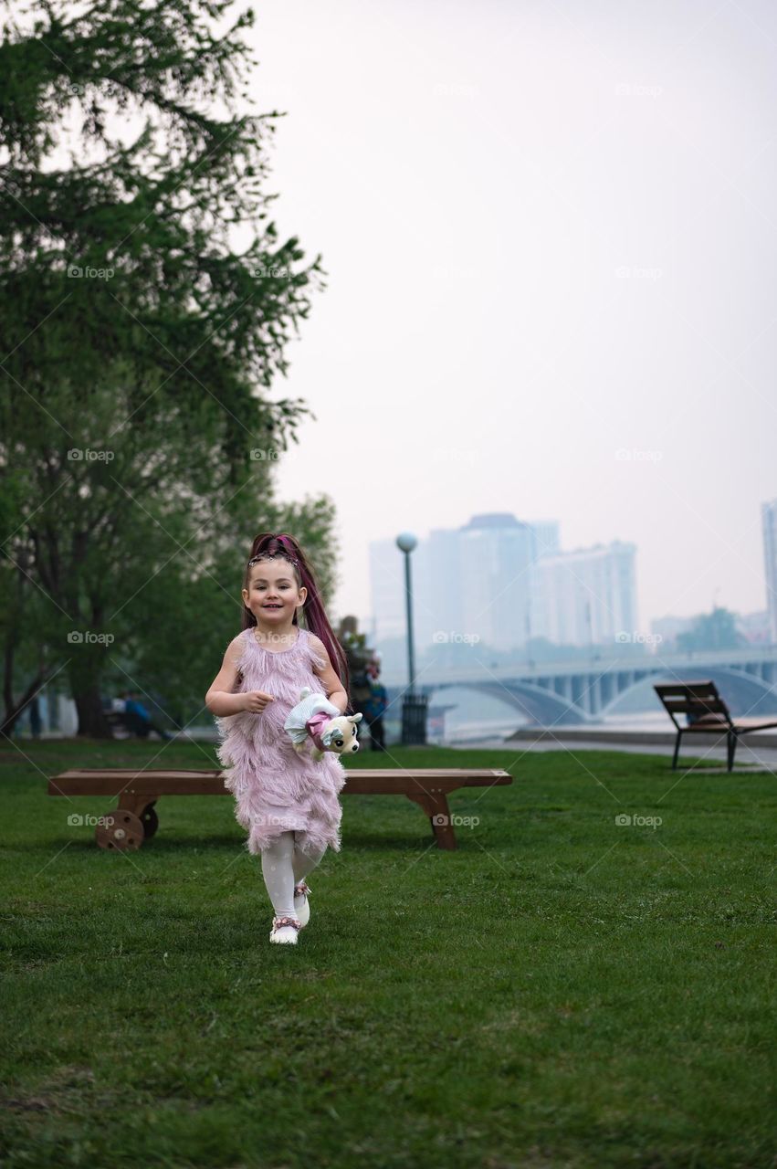 Child walking on urban park 