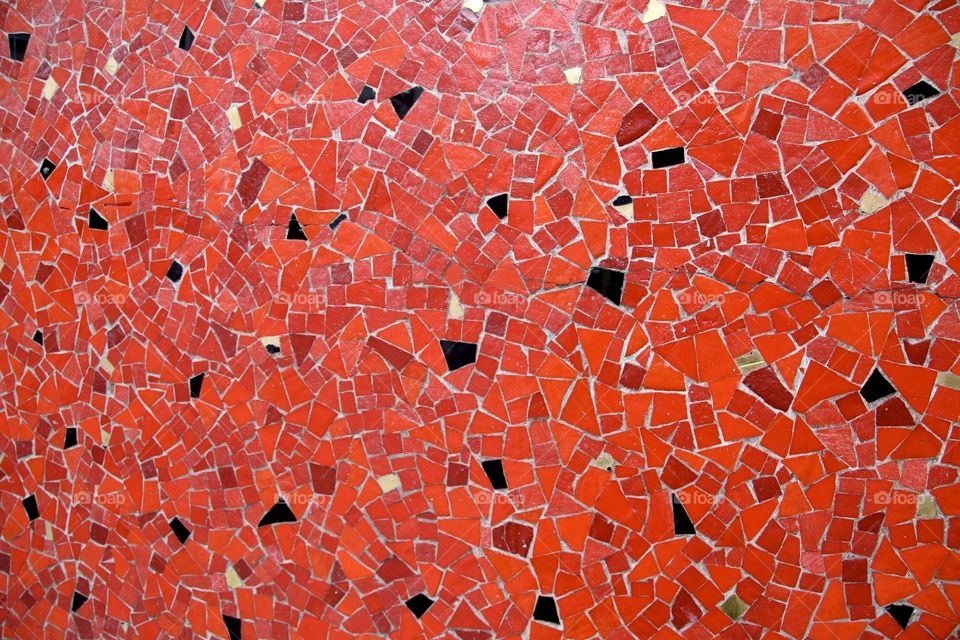 Red and black beautiful background of small mosaic peaces  ,photo taken in Paris 