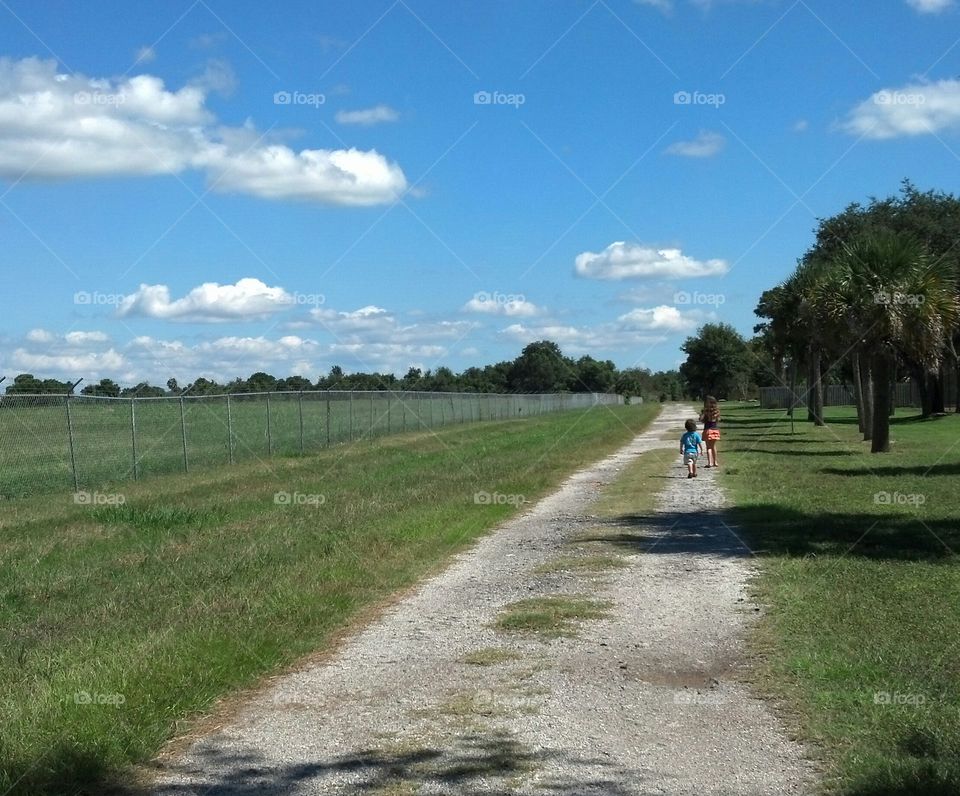 Kids walking along country road