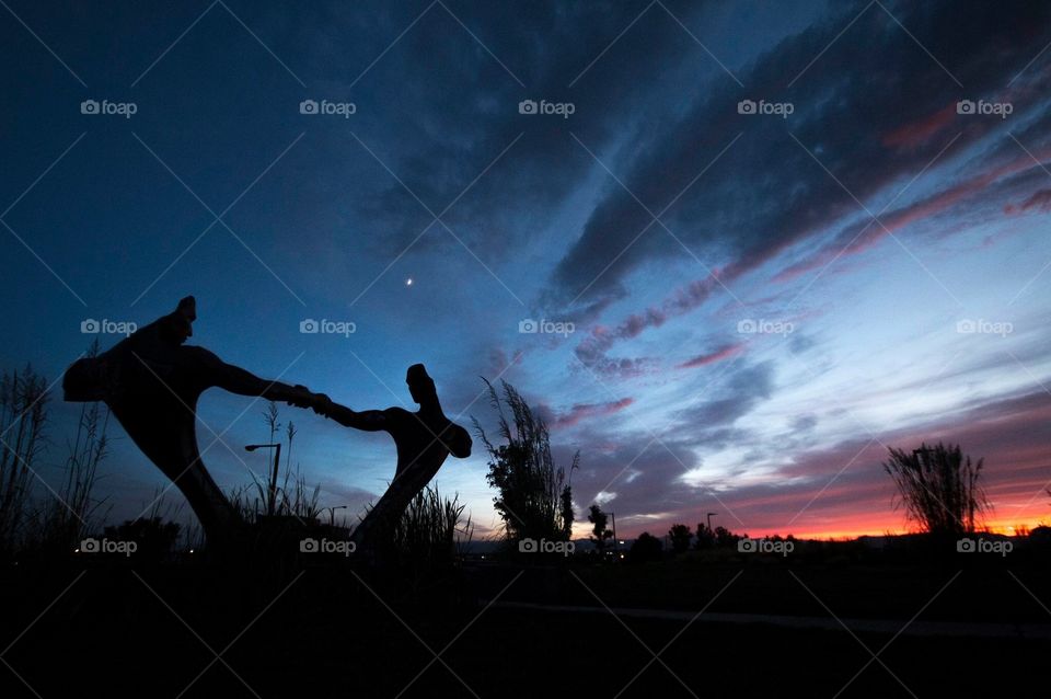 Being sunset with sculpture