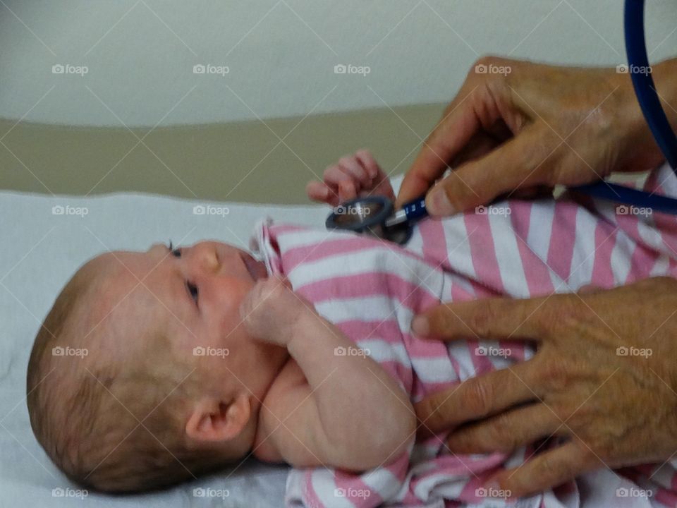 Newborn Baby Getting A Health Checkup
