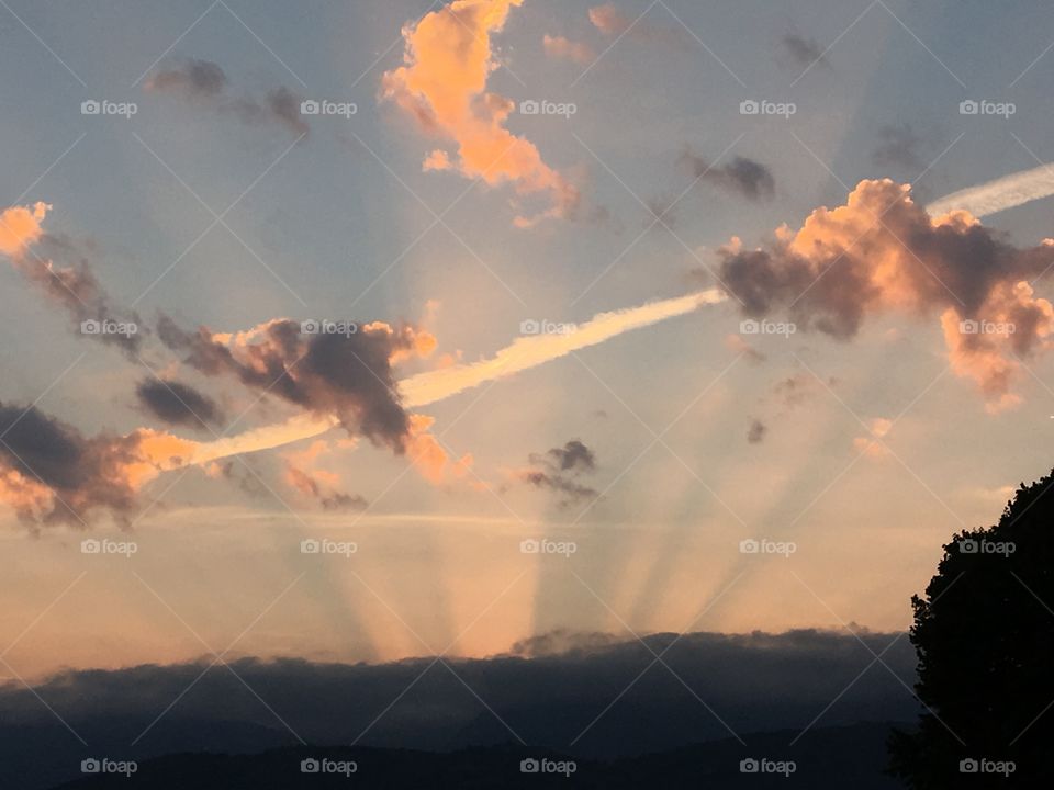 Sun beams in sky 