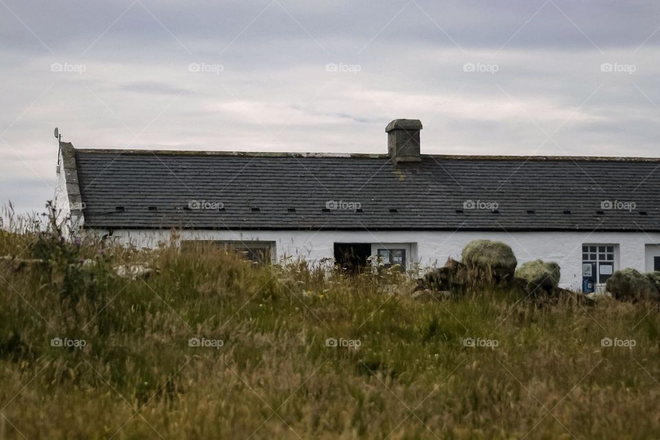 Beautiful cottage snuggled on a cliff