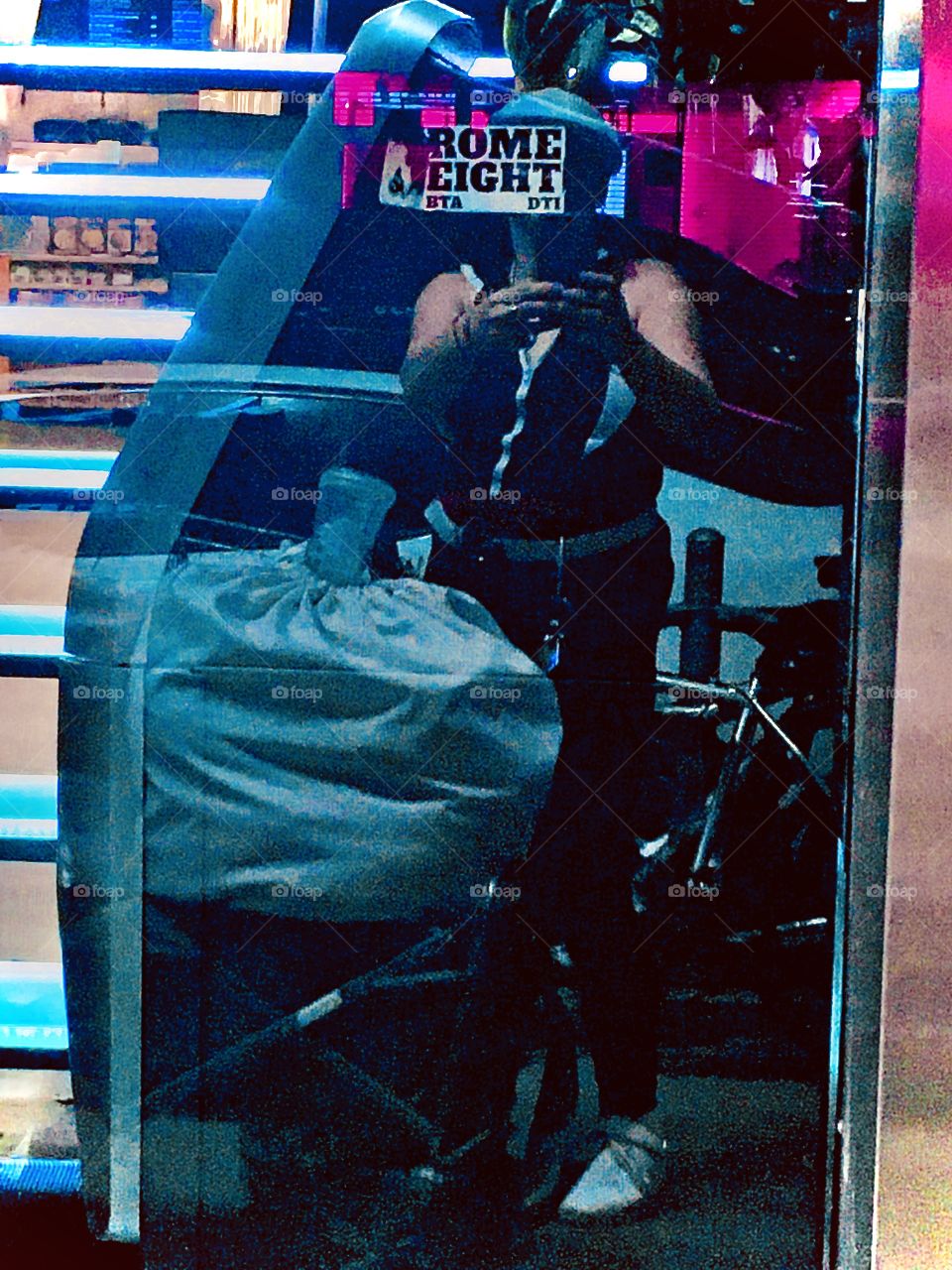 Closeup reflection of myself taking this picture in a store window with aluminum blinds somewhere in Long Island City, Queens, New York photographed in the summer of 2020. Hypnotic Productions