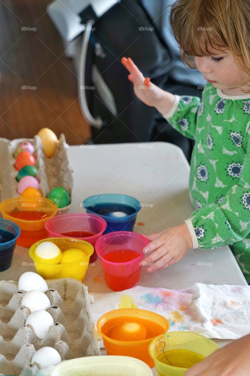 Young Girl Coloring Easter Eggs