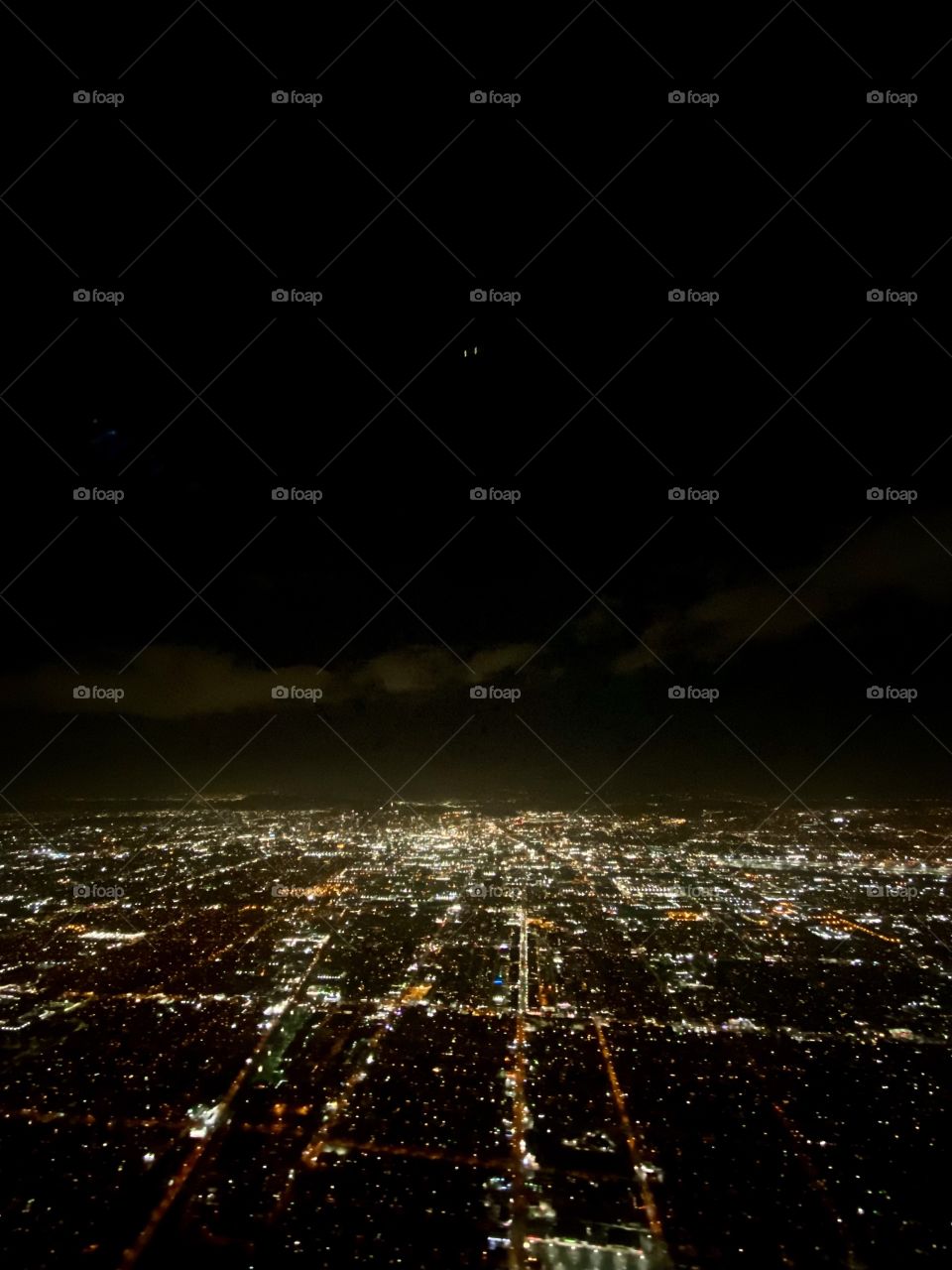 Flying over Los Angeles California at night about to land in Los Angeles International Airport (LAX)