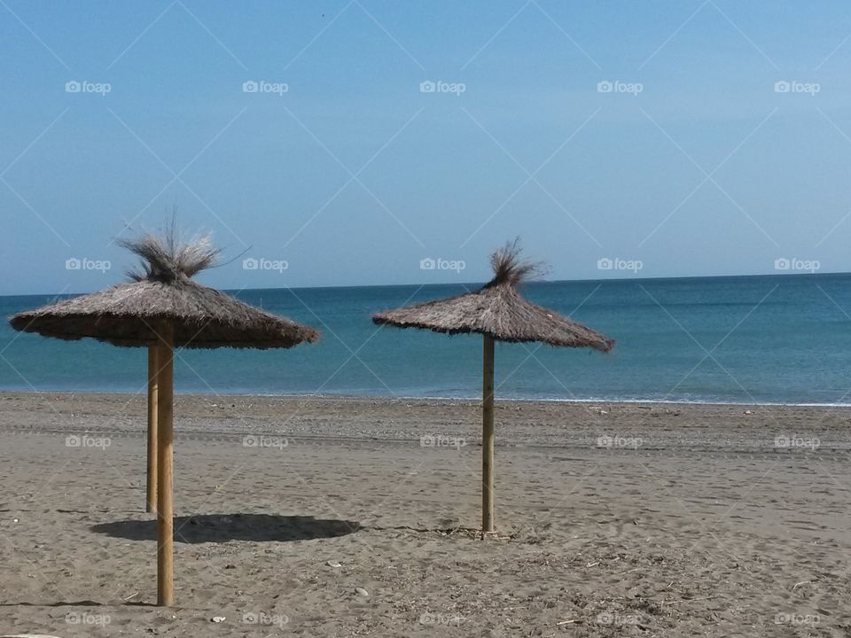 Sunshade in Spain. mediterranean sea and Beach