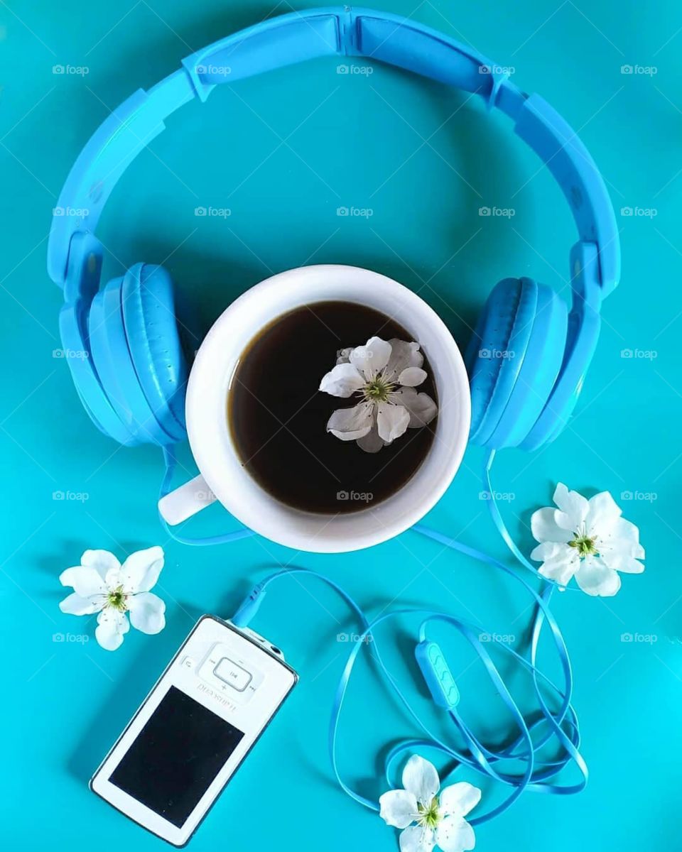 coffee, music player, headphones, flatlay