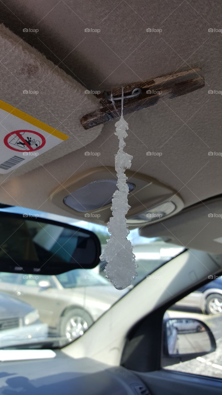 Rock candy brewed on road trip, drying on the sun visor.