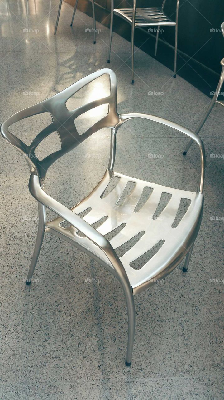 grey on grey. chair in open common area