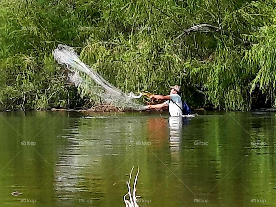 fishing man in river