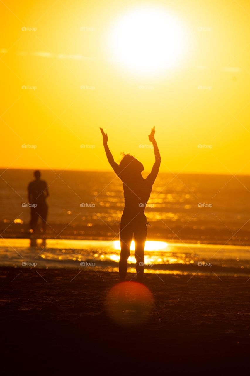 Sunset jump to reach the sun