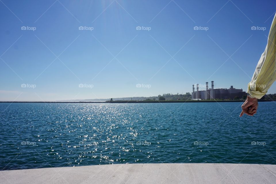 Person standing against sea