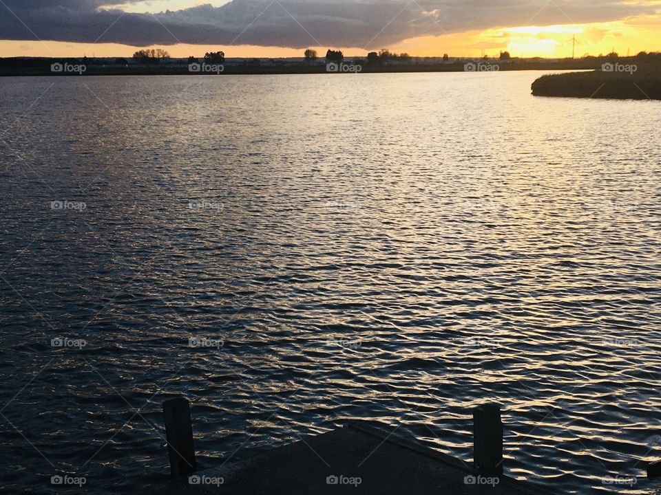 Sitting on the dock of the bay. Such a peaceful and relaxing experience looking over this beautiful lake in Kent at sunset.