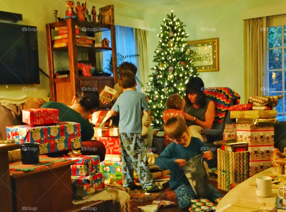 Family Opening Presents Christmas Morning
