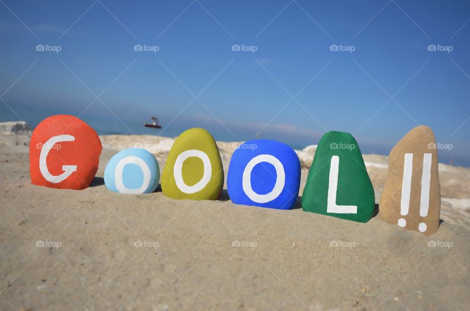 Soccer Goool !! Colored stones composition on the sand