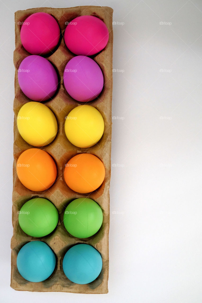 Dozen of easter eggs on egg carton