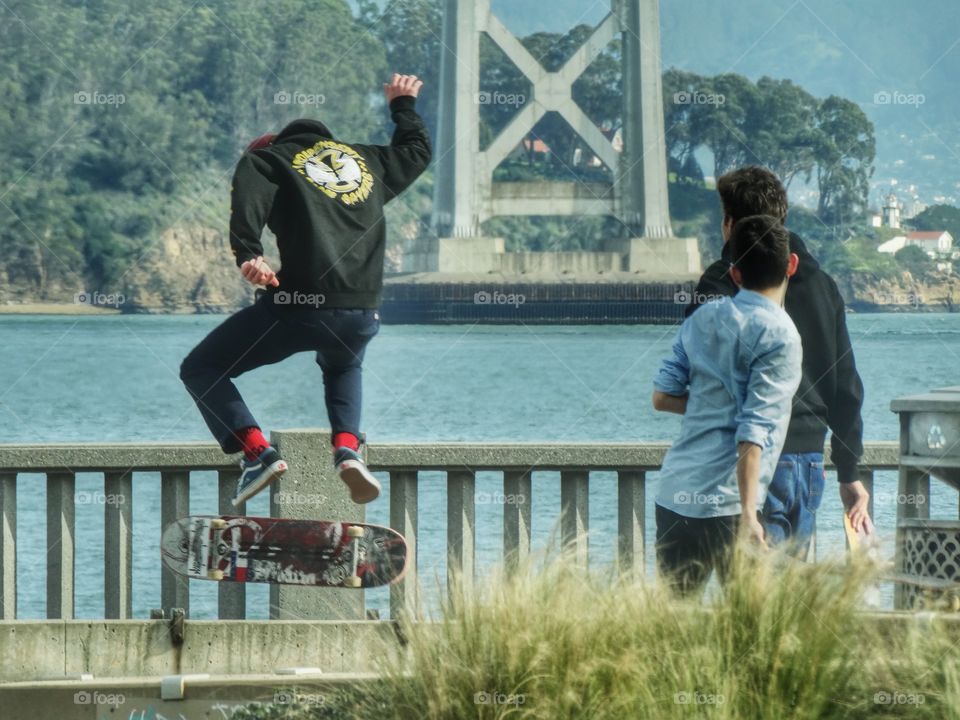 Young Men Riding Skateboards In The City