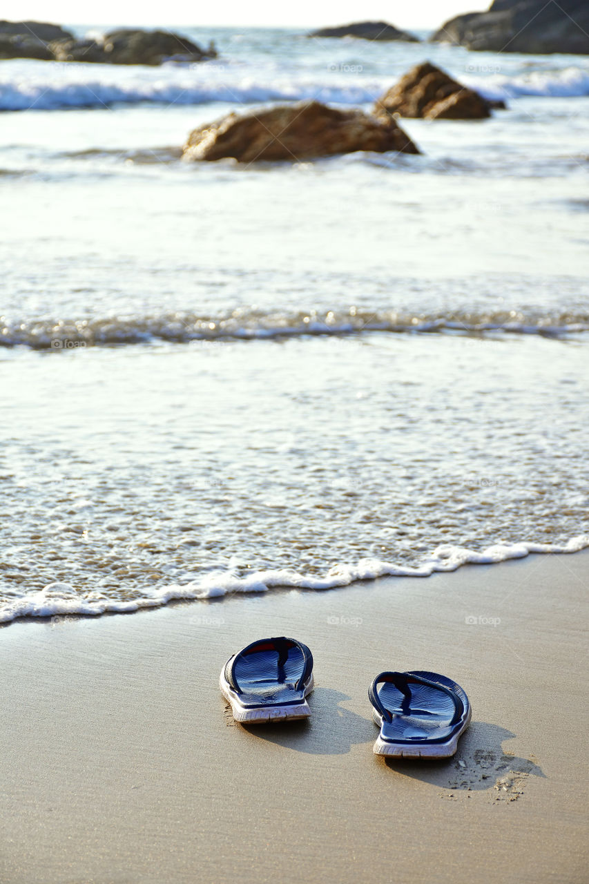 slippers in a beach